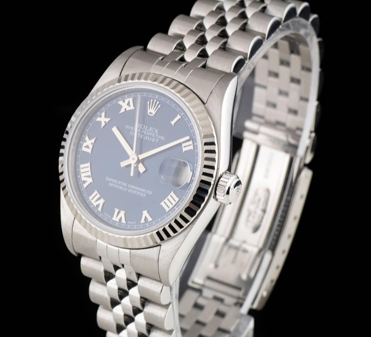 A Stainless Steel Oyster Perpetual Datejust Mid-Size Wristwatch, blue dial with applied roman numerals, date at 3 0'clock, a fixed 18k white gold fluted bezel, a stainless steel jubilee bracelet with a stainless steel deployant clasp, sapphire