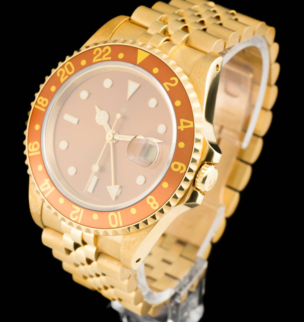 An 18k Yellow Gold Oyster Perpetual GMT-Master II Gents Wristwatch, brown dial with applied hour markers, date at 3 0'clock, an 18k yellow gold bi-directional rotating bezel with a "root beer" bezel insert, an 18k yellow gold jubilee