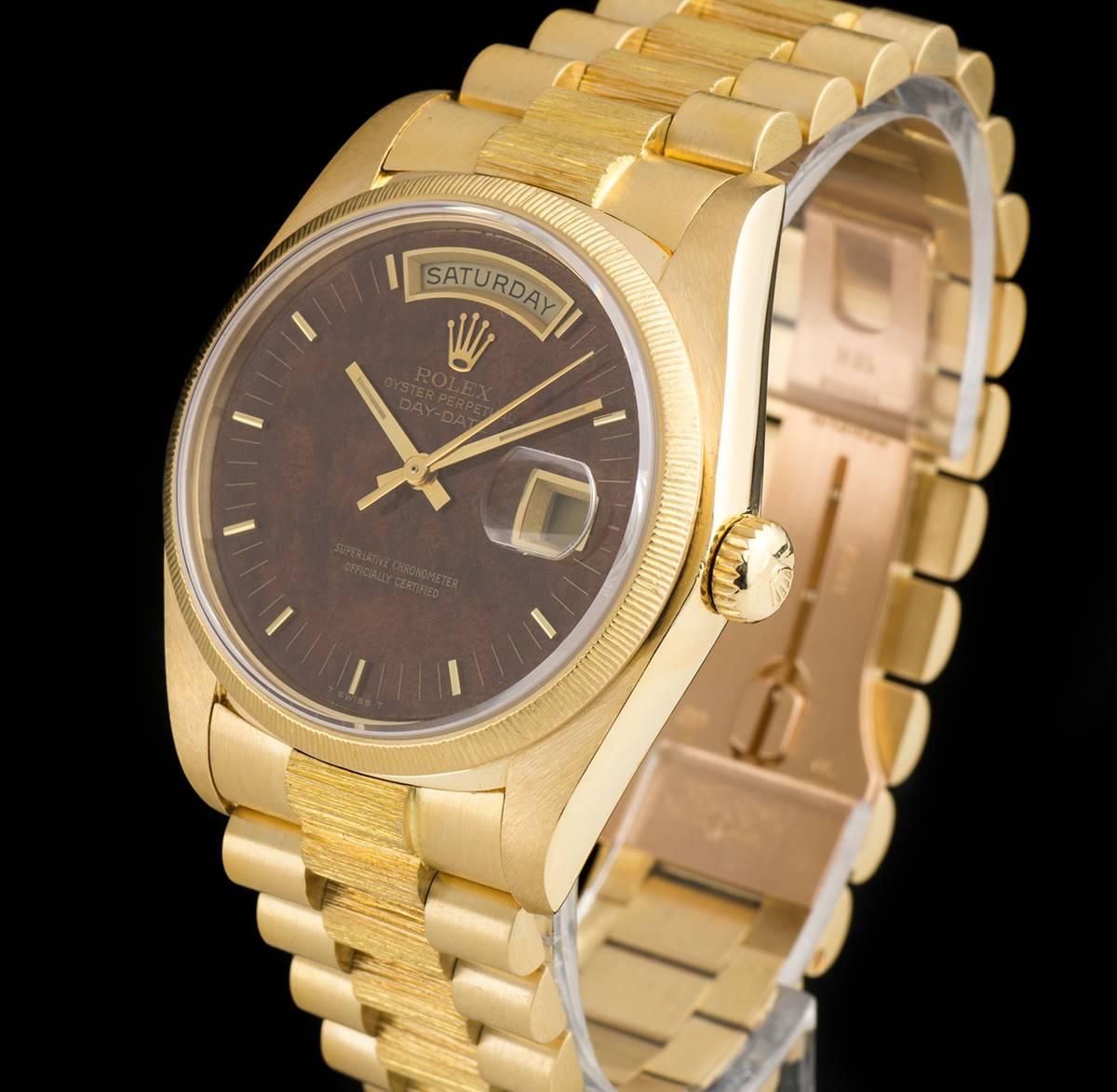 A Rare 18k Yellow Gold Oyster Perpetual Day-Date Gents Wristwatch, rare wood dial with applied hour markers, day aperture at 12 0'clock, date at 3 0'clock, a fixed 18k yellow gold bark finish bezel, an 18k yellow gold president bracelet with bark