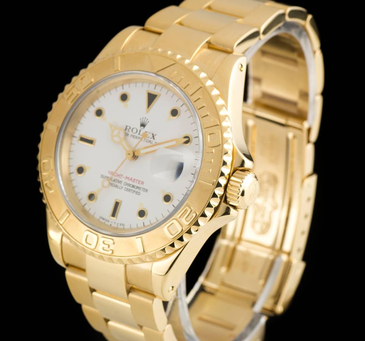 An 18k Yellow Gold Oyster Perpetual Yacht-Master Gents Wristwatch, white dial with applied hour markers, date at 3 0'clock, an 18k yellow gold uni-directional rotating bezel, an 18k yellow gold oyster bracelet with an 18k yellow gold oysterlock