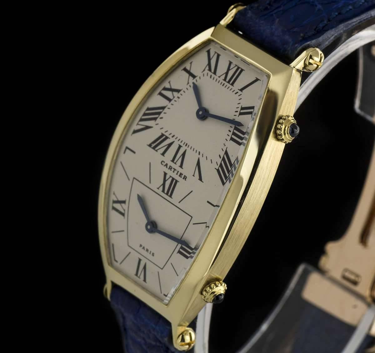 An 18k Yellow Gold Tonneau Cintree Dual Time Mid-Size Wristwatch, top silver dial with roman numerals and blued steel sword shaped hands, bottom silver dial with hour markers and roman numerals III, IV, IX & XII and blued steel sword shaped