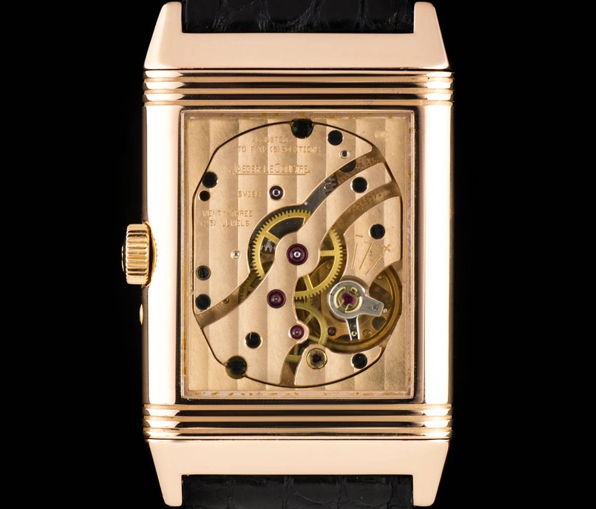 An 18k Rose Gold 60th Anniversary Reverso Gents Wristwatch, silver dial with arabic numbers, date indicator on inner edge of dial, small seconds at 6 0'clock, power reserve display between 10 and 11 0'clock, a fixed 18k rose gold bezel, a black
