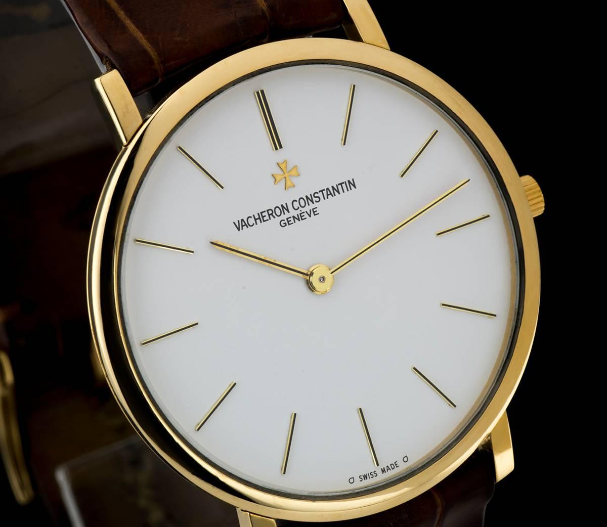 An 18k Yellow Gold Ultra Thin Gents Wristwatch, white dial with applied hour markers, a fixed 18k yellow gold bezel, an original brown leather strap with an original 18k yellow gold pin buckle, mineral glass, manual wind movement, in excellent