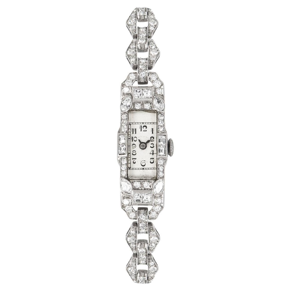 Montre-bracelet cocktail vintage à cadran argenté et platine serti de diamants en vente