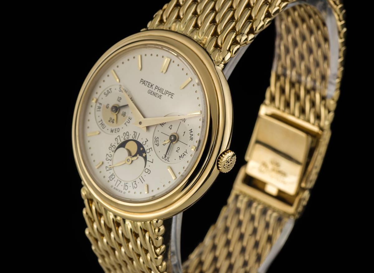 An 18k Yellow Gold Perpetual Calendar Moonphase Gents Wristwatch 3945J, silvered dial with applied hour markers and applied minute markers, month and leap year cycle at 3 0'clock, date and moonphase displayed at 6 0'clock, 24 hour indicator and