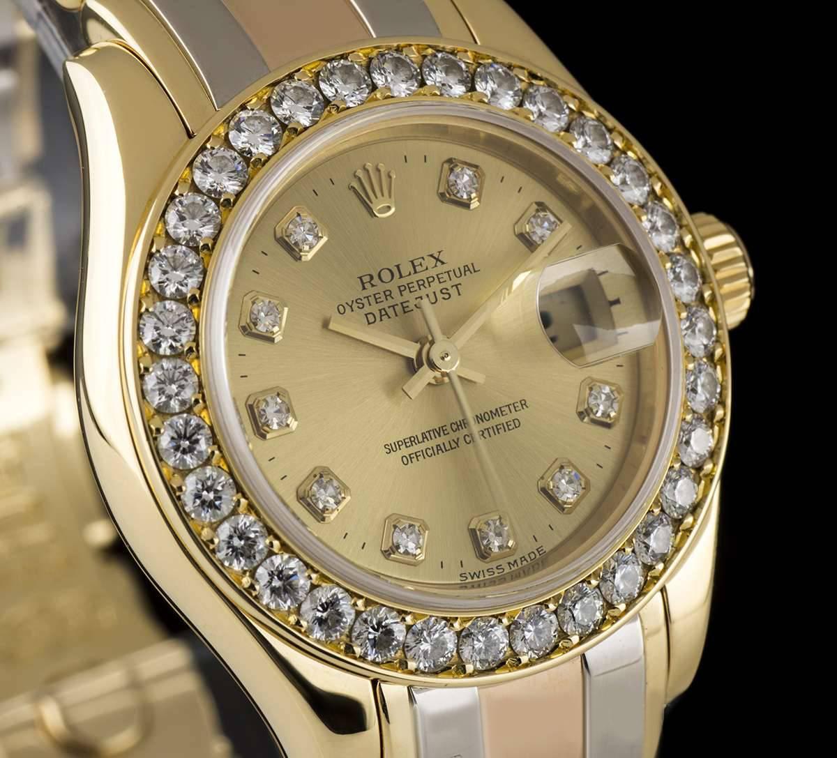A Gold Tridor Oyster Perpetual Datejust Ladies Wristwatch, champagne dial with 10 applied round brilliant cut diamond hour markers, date at 3 0'clock, a fixed  yellow gold bezel set with approximately 32 round brilliant diamonds, an 18k tridor
