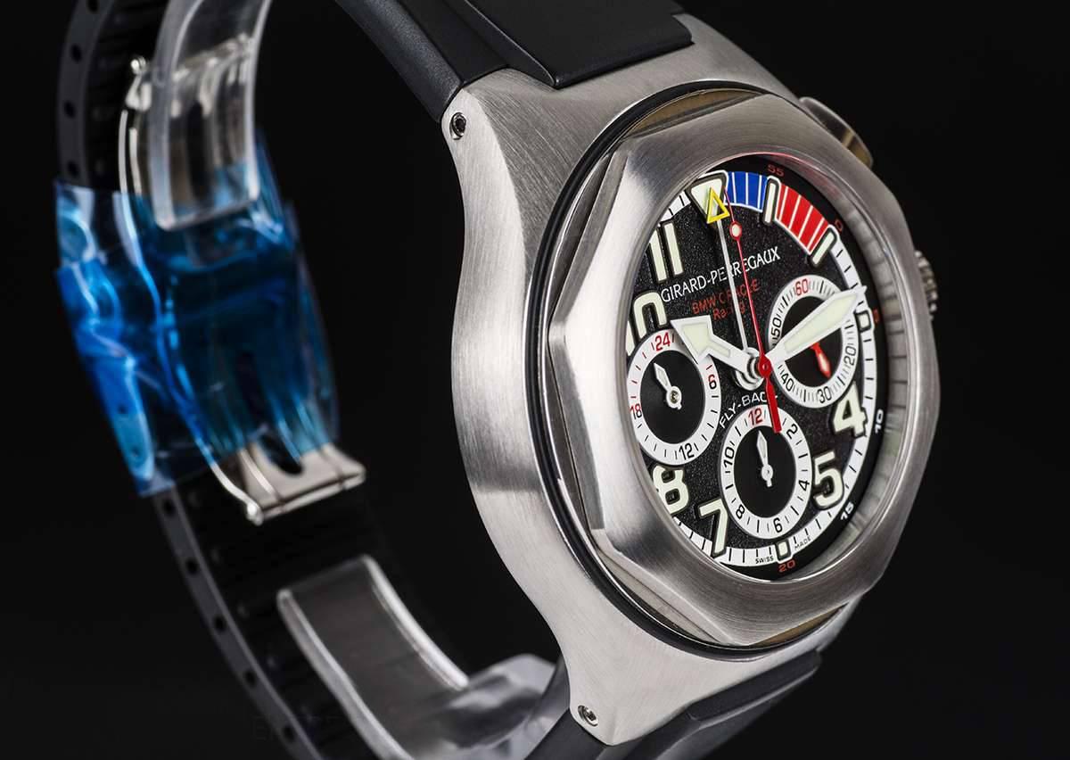 A Titanium BMW Oracle Racing Limited Edition Gents Wristwatch Reference 80175-25-652-FK6A, it has a black dial with arabic numbers and index batons, small seconds at 3 0'clock, 12 hour recorder at  6 0'clock, 24 hour recorder at 9 0'clock, printed