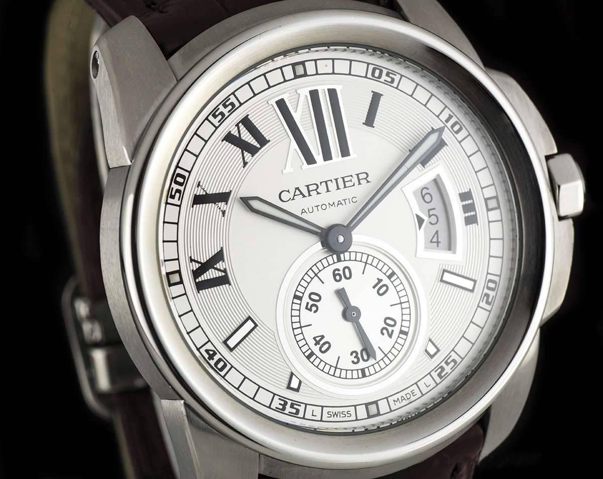 A Stainless Steel Calibre De Cartier Gents Wristwatch, silvered partially opaline dial with roman numerals and a secret signature at "X", date aperture at 3 0'clock, small seconds at 6 0'clock, a fixed stainless steel bezel, an original