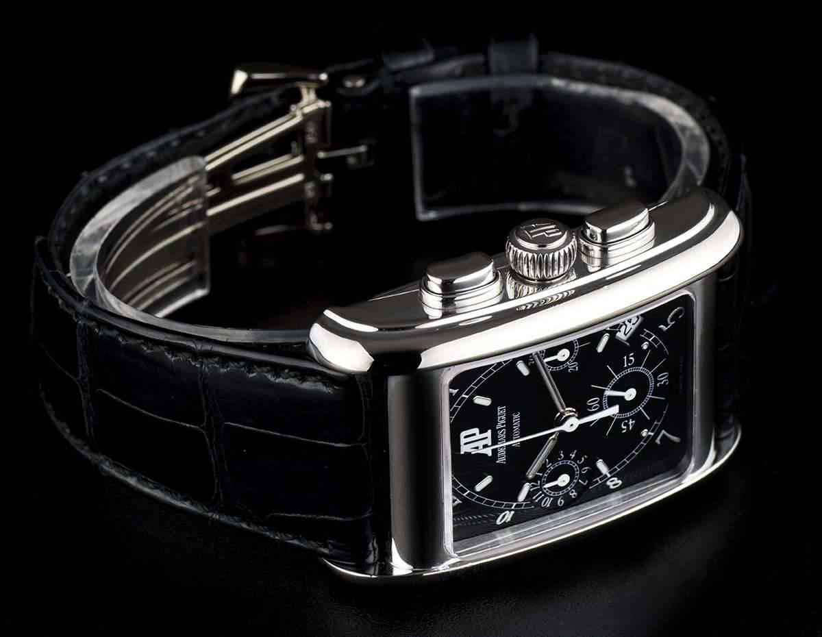 An 18k White Gold Edward Piguet Chronograph Gents Wristwatch, black dial with applied arabic numbers and hour markers, 30 minute recorder at 3 0'clock, date between 4 and 5 0'clock, small seconds at 6 0'clock, 12 hour recorder at 9 0'clock, a fixed