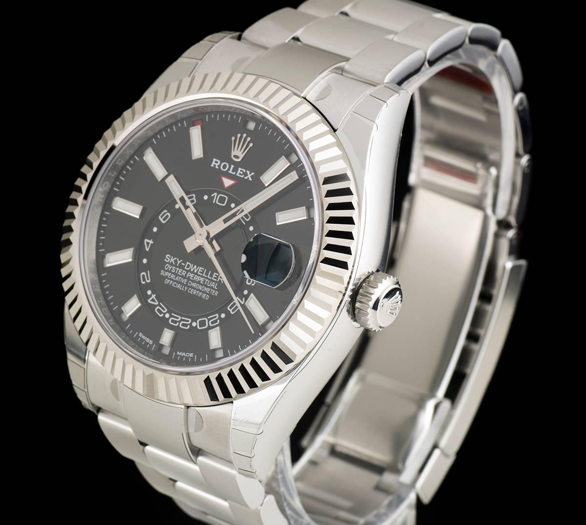 An Unworn Stainless Steel Oyster Perpetual Sky-Dweller Gents Wristwatch, black dial with applied hour markers, date at 3 0'clock, 24 hour display, second time zone, annual calendar with saros system and month display, an 18k white gold