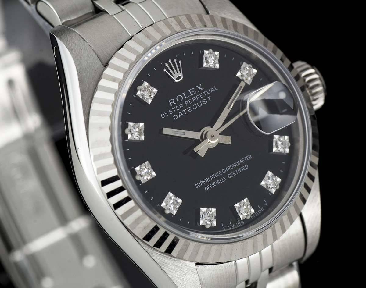 A Stainless Steel Oyster Perpetual Datejust Ladies Wristwatch, black dial with 10 applied round brilliant cut diamond hour markers, date at 3 0'clock, a fixed 18k white gold fluted bezel, a stainless steel jubilee bracelet with a stainless steel
