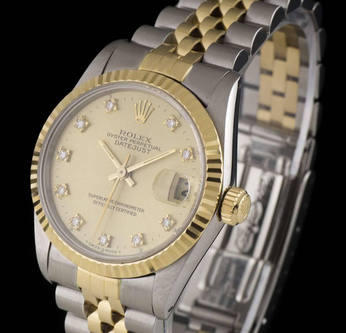 A Stainless Steel and 18k Yellow Gold Oyster Perpetual Datejust Mid-Size Wristwatch, champagne dial with 10 applied round brilliant cut diamond hour markers, date at 3 0'clock, a fixed 18k yellow gold fluted bezel, a stainless steel and 18k yellow