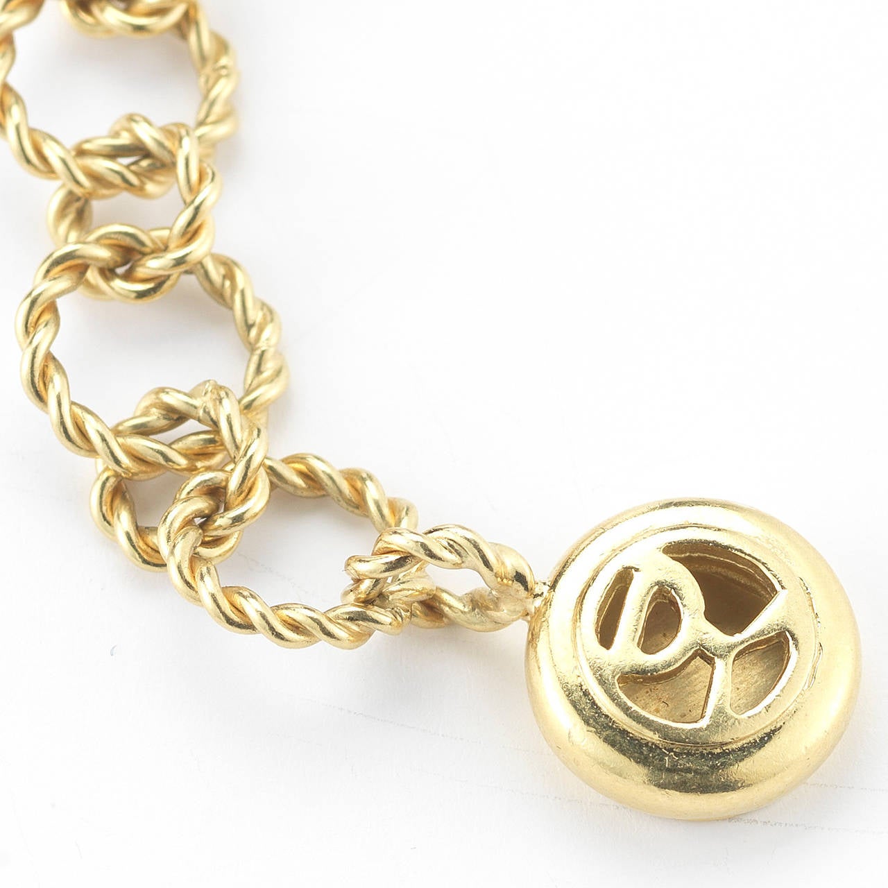 This unique David Yurman 18K yellow gold necklace features Yurman's classic cable twist workmanship throughout in a checkerboard mosaic outline creating a dramatic show stopping choker accented with pave diamonds surrounded by white gold.