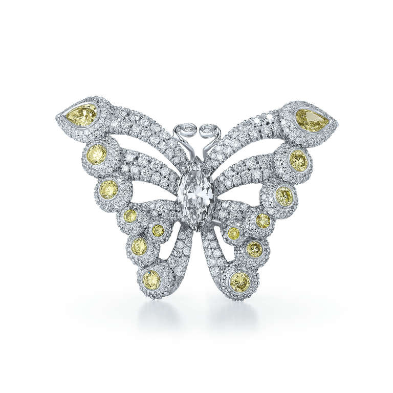 One 18K White Gold Kwiat Butterfly Ring from the Legacy Collection. The center stone in this Butterfly Ring is a Natural Fancy Gray Marquise Diamond that weighs 1.02 carats. This ring weighs 5.38 carats in total, and its diamonds are FG in color and