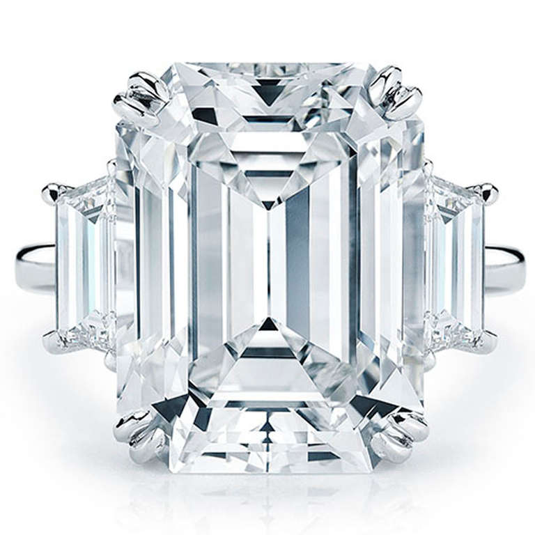 One Platinum GIA Certified 8.02 D/VS2 Emerald Cut Engagement Ring. The ring also contains 2 trapezoid diamonds that weigh 1.26 carats in total, and are DE in color and VS in clarity.