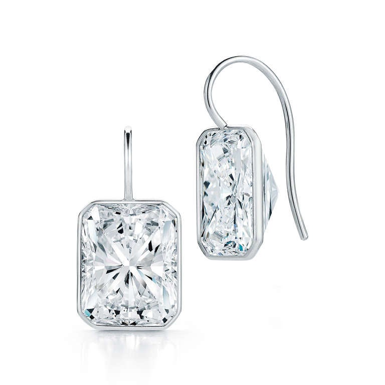 One pair of Radiant Cut Diamond Earrings on a Wire. The diamonds are GIA Certified and are J in color and VS1-SI1 in clarity. They weigh 12.19 carats in total.