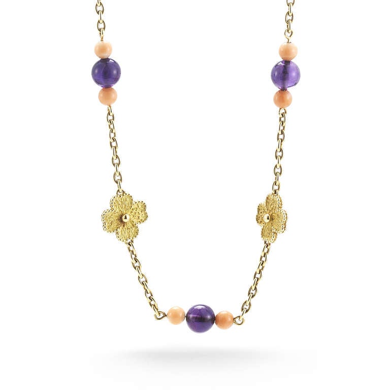 This stunning French 18kt Necklace is perfect for wearing long, or doubling up. It has beautiful clovers with gold dots in the center, and also alternated between coral and amethysts. The chain is 36