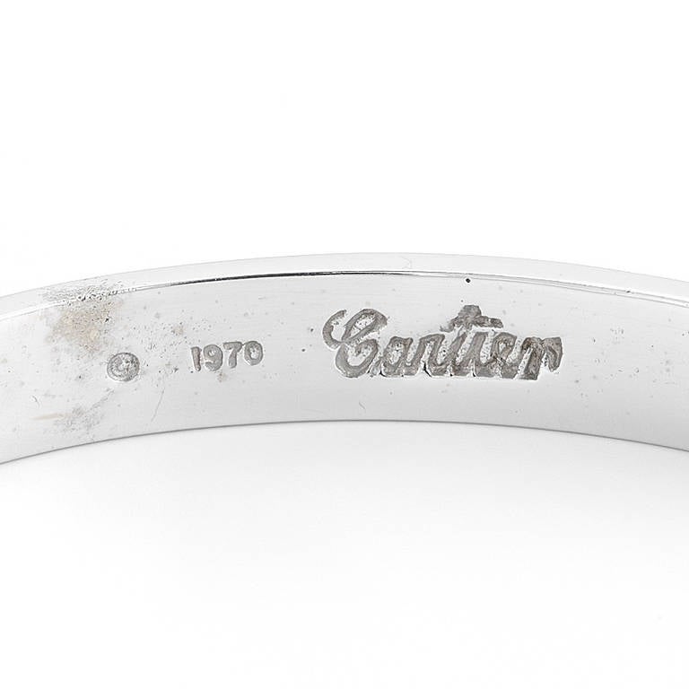 A timeless, highly coveted Cartier Love Bracelet in 18k white gold. This beautiful bracelet is a signature Cartier piece, and is a perfect bracelet to be worn throughout the day and into the night. This bracelet was designed by Aldo Cipullo, a