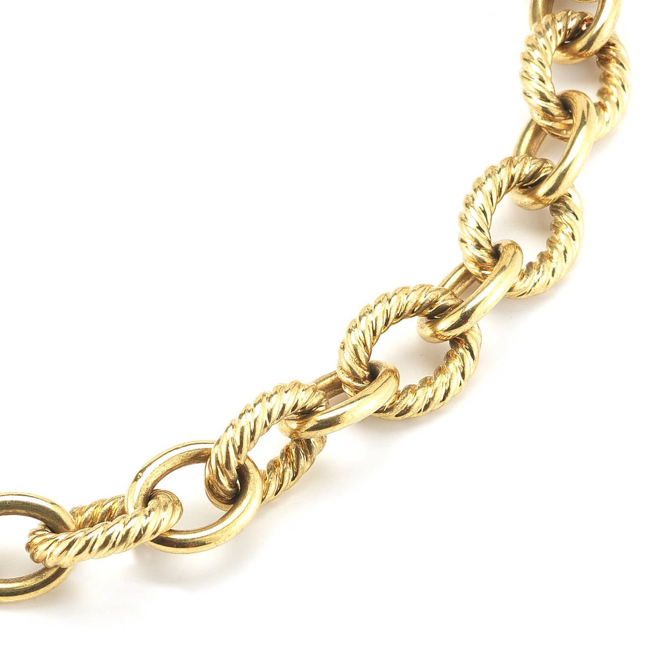 The transformation of simple chains into works of striking jewelry speaks to the artful eye and skillful hand of David Yurman.  A simple box chain is finessed into a sensual strand of soft corners and edges.  In the wheat chain, metal is carefully