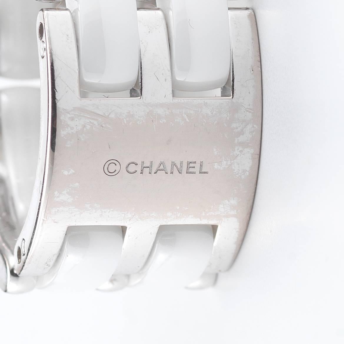 Gorgeous Chanel Ultra Ring with three rows of diamonds and two rows of white ceramic. Size 5.75, stamped serial # 00867. 