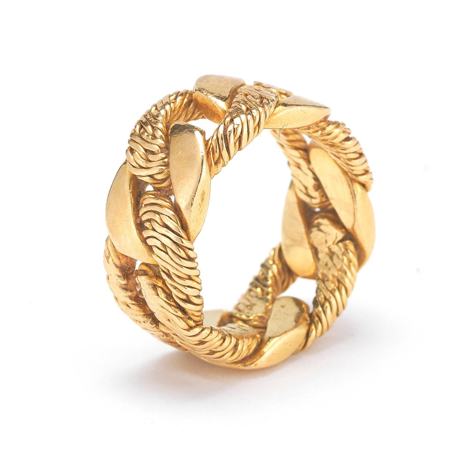 A gorgeous Hermes 18K Yellow Gold ring. Size 5.25, 7.5mm wide. Interlocking all the way around!