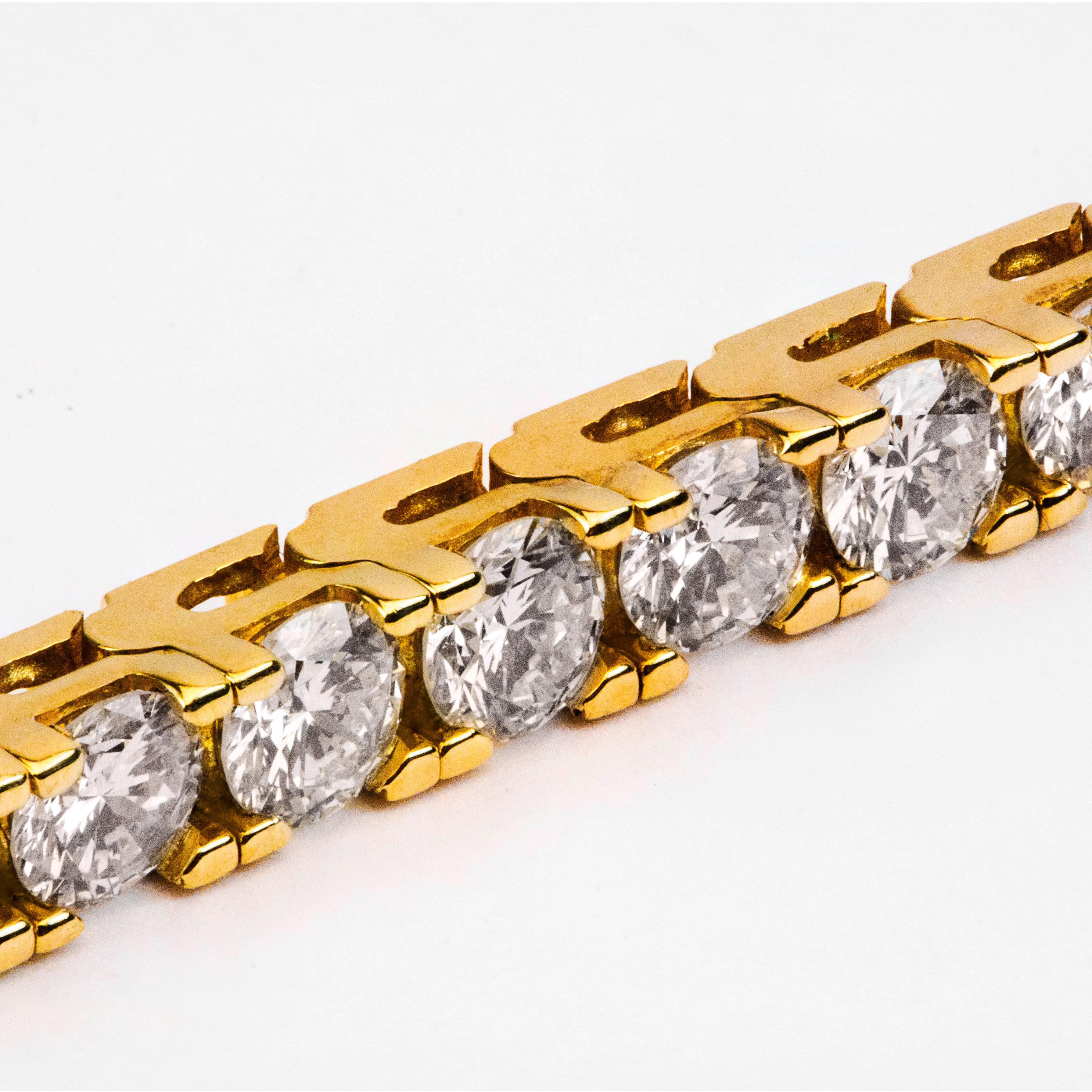 This tennis bracelet features 42 brilliant round diamonds set in 14K yellow gold. The total weight of the diamonds is 8.68 carats, F-G color and VS2-SI  in clarity. Made in 14K yellow gold, 7 inches long and 3.5mm width.  Perfect for your everyday