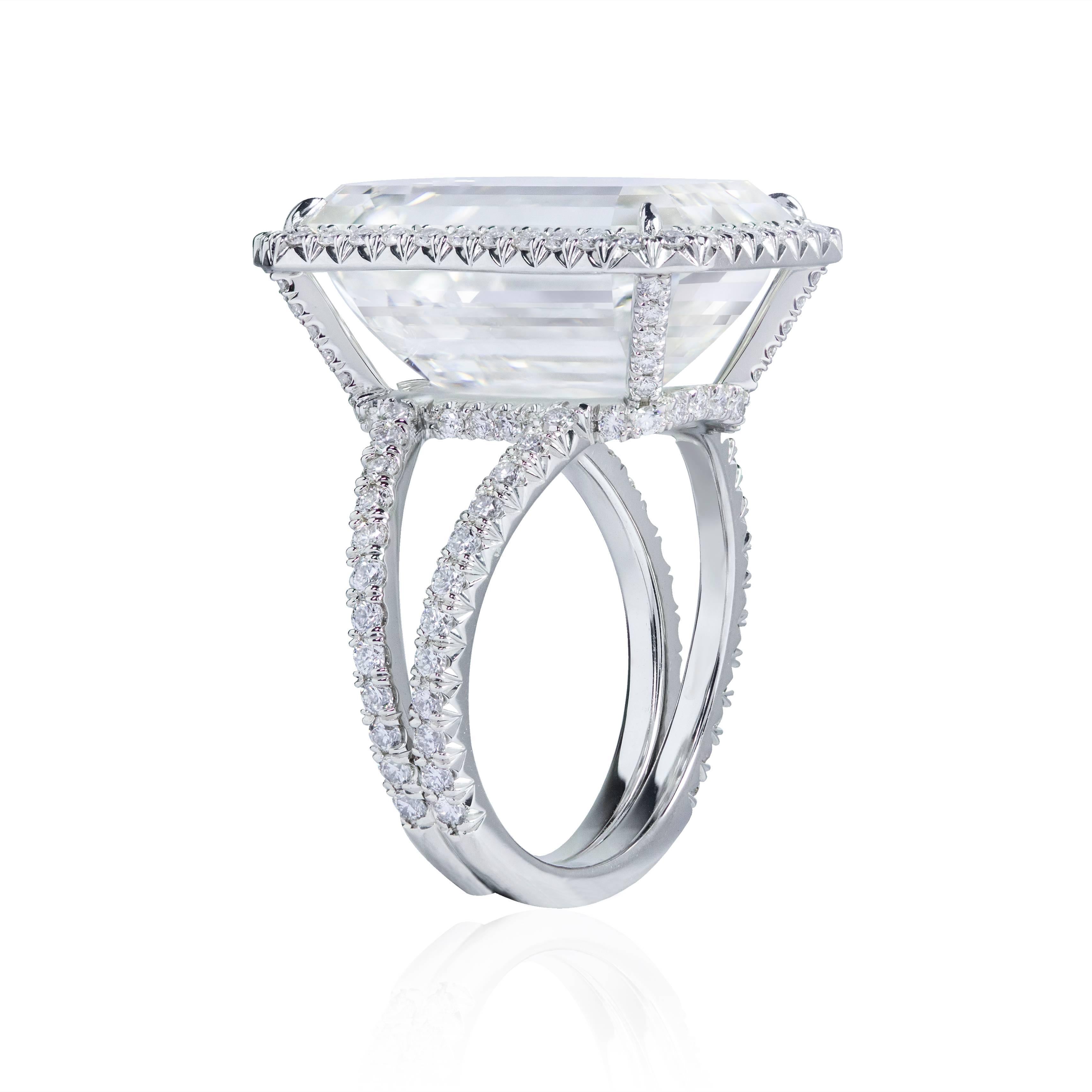 This important and elegant ring features a 15 carats emerald cut diamond center stone that GIA certified as K color and VS2 in clarity. Surrounded by a single row of round brilliant diamonds and set in a split shank setting accented by round melee