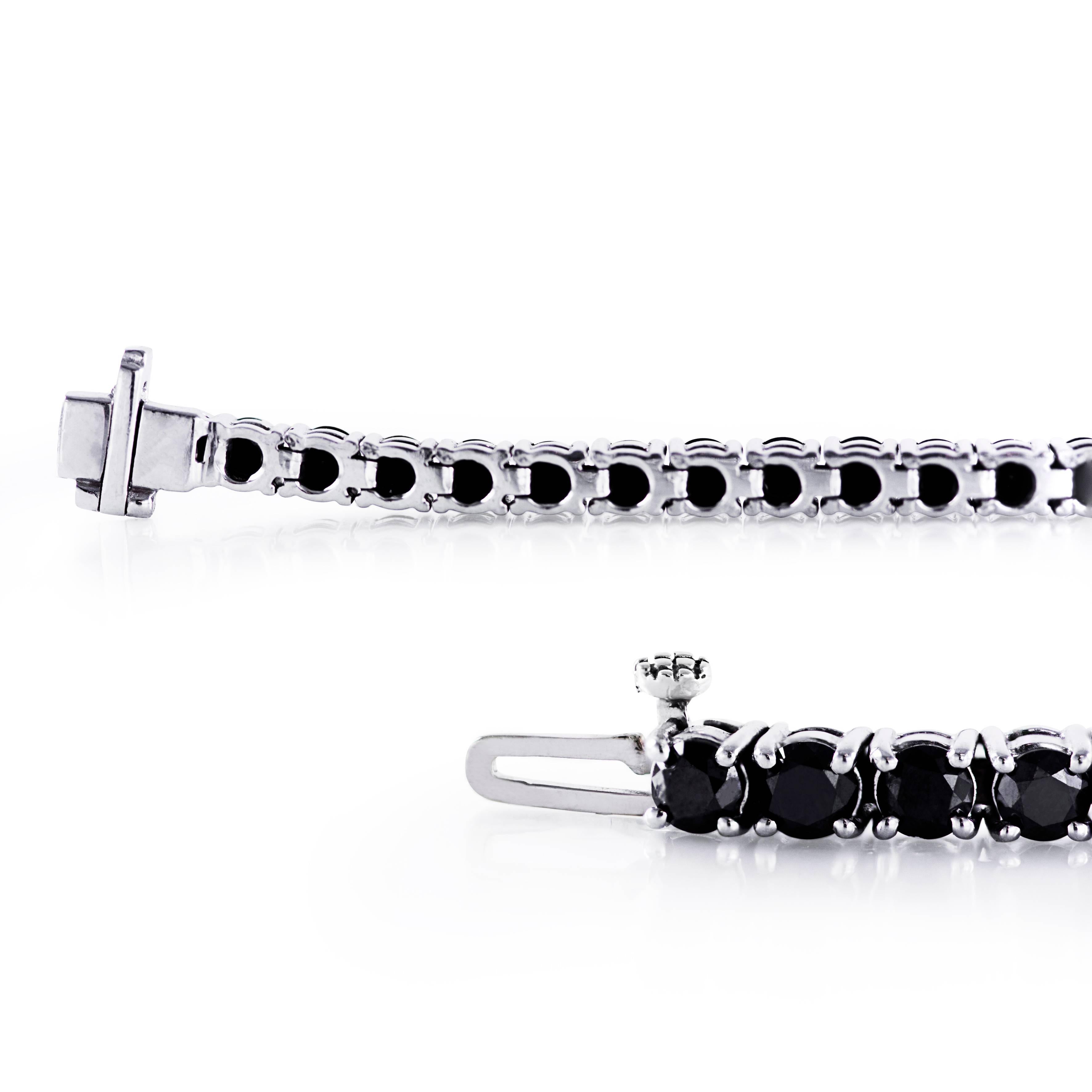 This tennis bracelet features 50 round brilliant black diamonds weighing 7.97 carats total set in a 4 prong setting. Made in 14k white gold. Size is 7 inches.

Style available in different price ranges. Prices are based on your selection of the 4C’s
