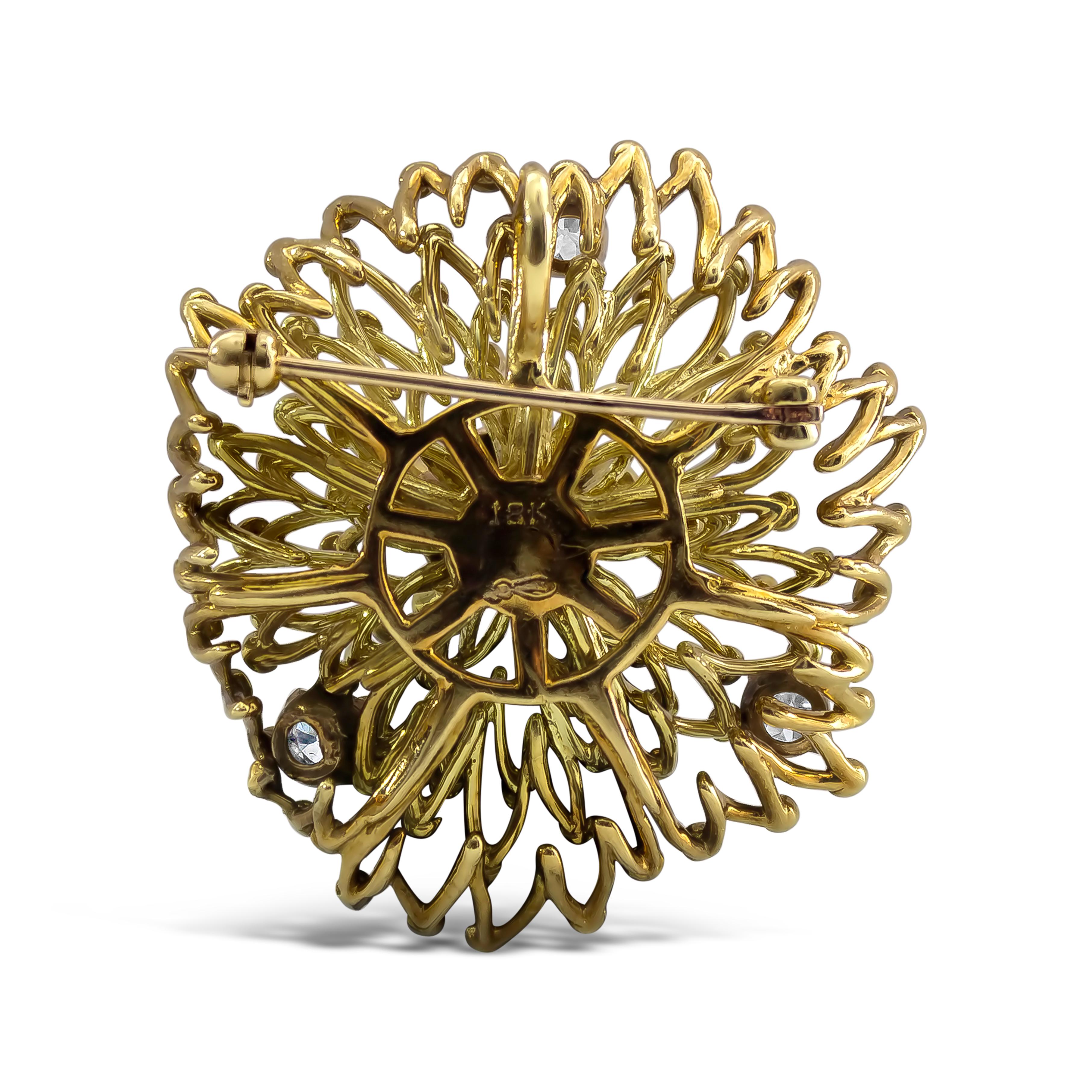 Showcasing an antique intricately designed brooch made in 18K Yellow Gold, accented with clusters of Old European cut diamonds weighing 0.98 carats total.



