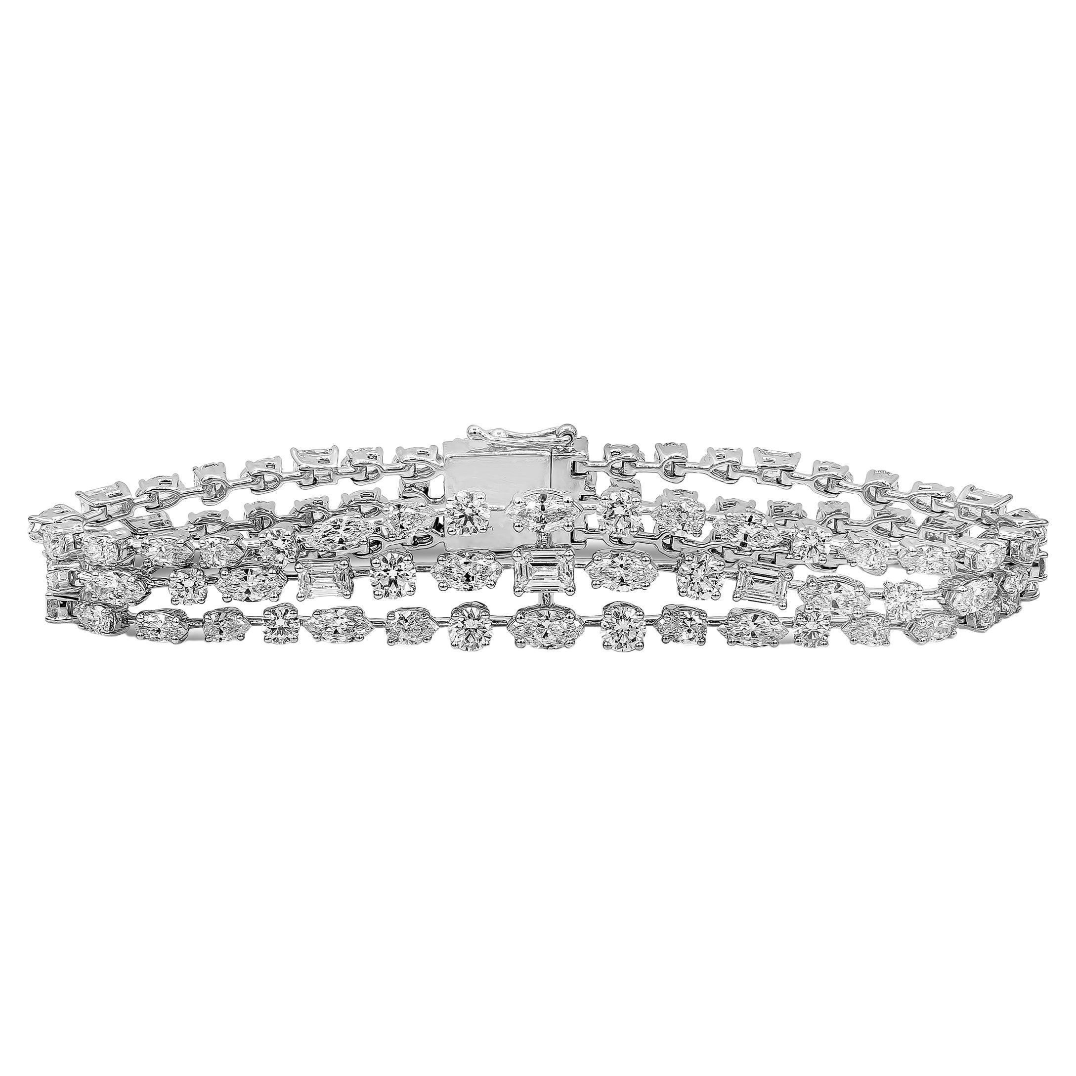 This elegant and fashionable bracelet showcasing three-rows of mix cut diamonds that graduate larger as it gets to the center. Diamonds weigh 12.03 carats total, G-H color and VS-SI in clarity. Made with 18K White Gold.

Roman Malakov is a custom