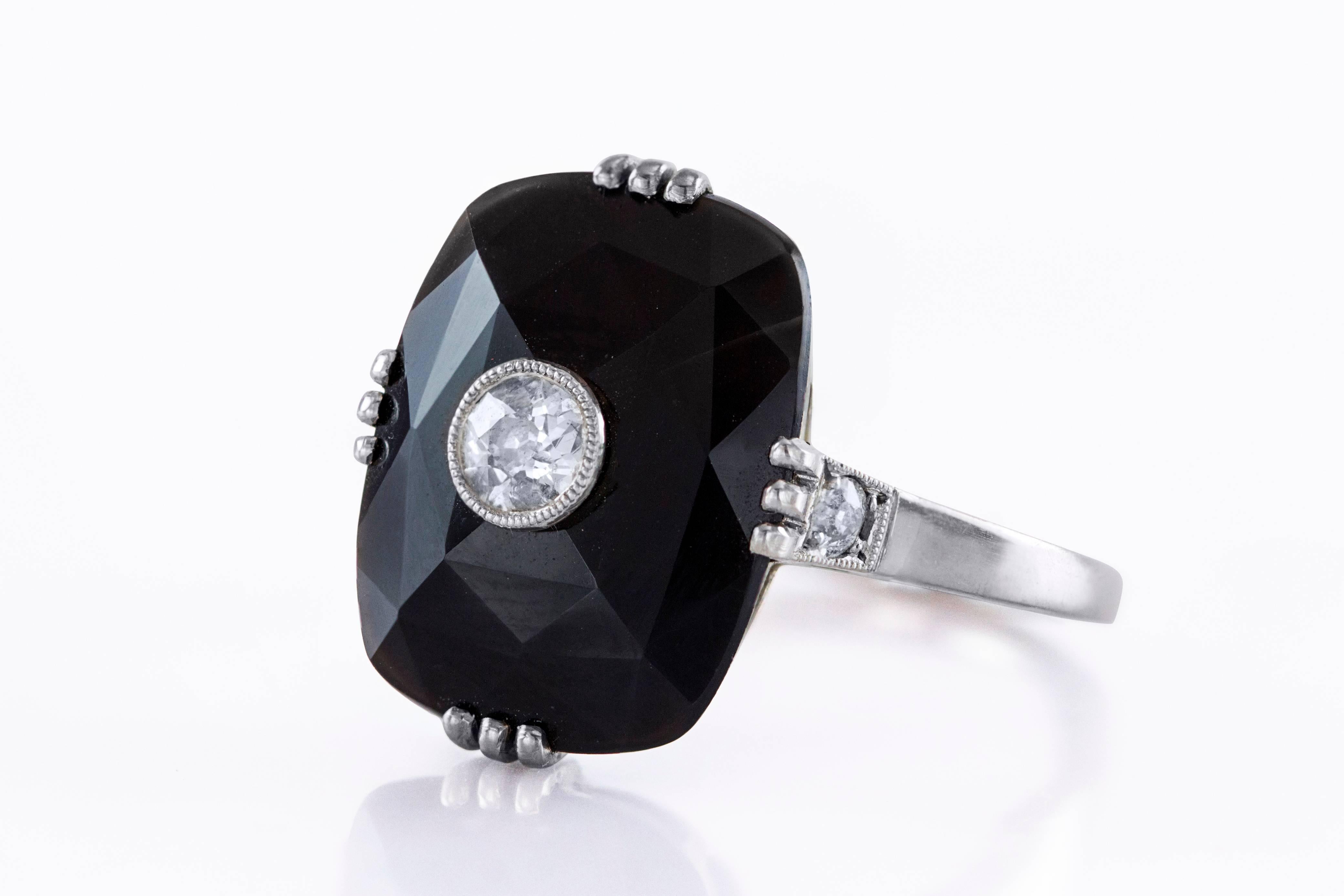 Features an Old European diamonds weighing 0.25 carat total, flushed set in the center of faceted rectangular shape onyx and accented diamonds on each side mounted on top of shank. Made with 18K White Gold, Size 5 1/4 US

Style available in