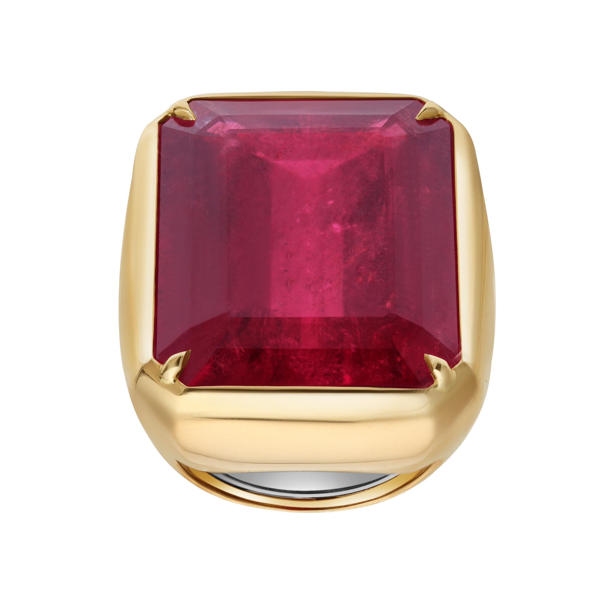 A stylish cocktail ring, showcasing a 37.37 carats emerald cut rubellite tourmaline, bezel-set with four claw prongs. Finely made with an 18K yellow gold mounting. Size 7 US, resizable upon request. 