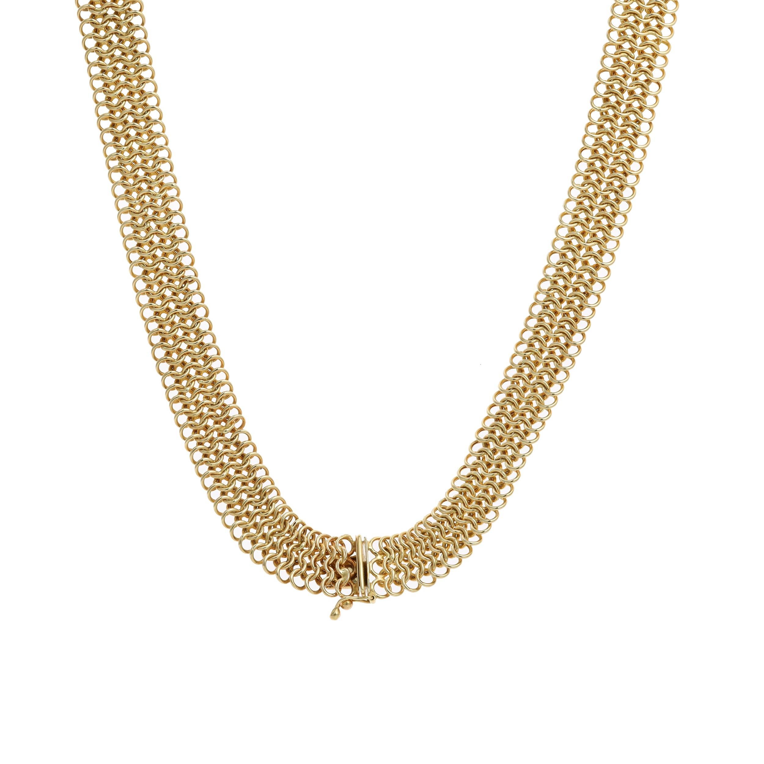 A versatile fashion necklace, featuring five rows of interlocking circular links made of 14K yellow gold. This necklace weighs 44.22 grams and 26 inches in length. Perfect for casual wear. 

