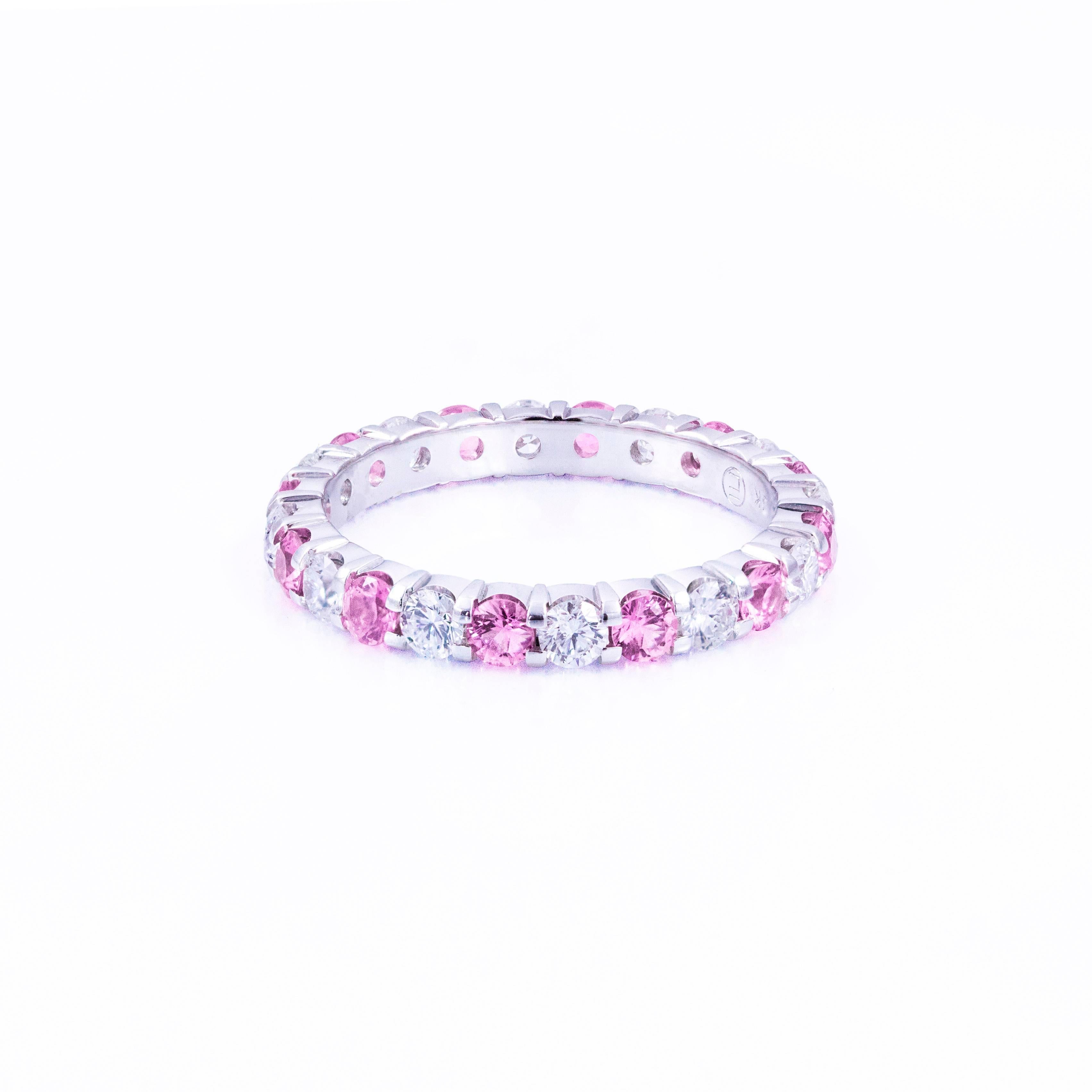 This gorgeous ring is set 12 natural pink sapphires weighing 1.02 carats that alternate with 12 round brilliant diamonds weighing 0.86 carats total. Set in 18k white gold. Size 7 US.

Style available in different price ranges. Prices are based on
