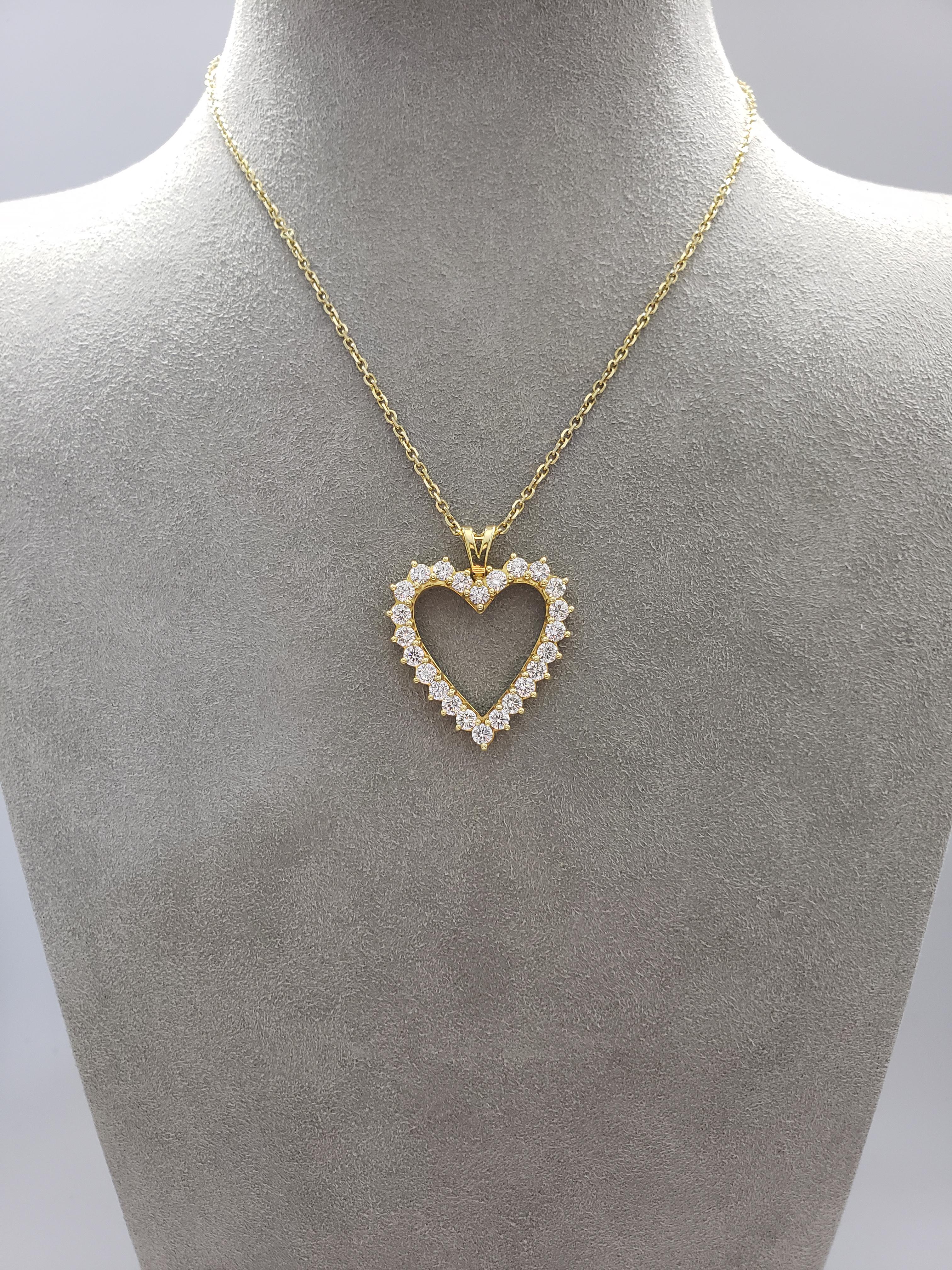 Of open-work design, showcasing brilliant round diamonds set in a heart shape. Diamonds weigh 2.92 carats total. Set in 18 karat yellow gold. Attached to an 14 inch yellow gold chain.

Style available in different price ranges. Prices are based on