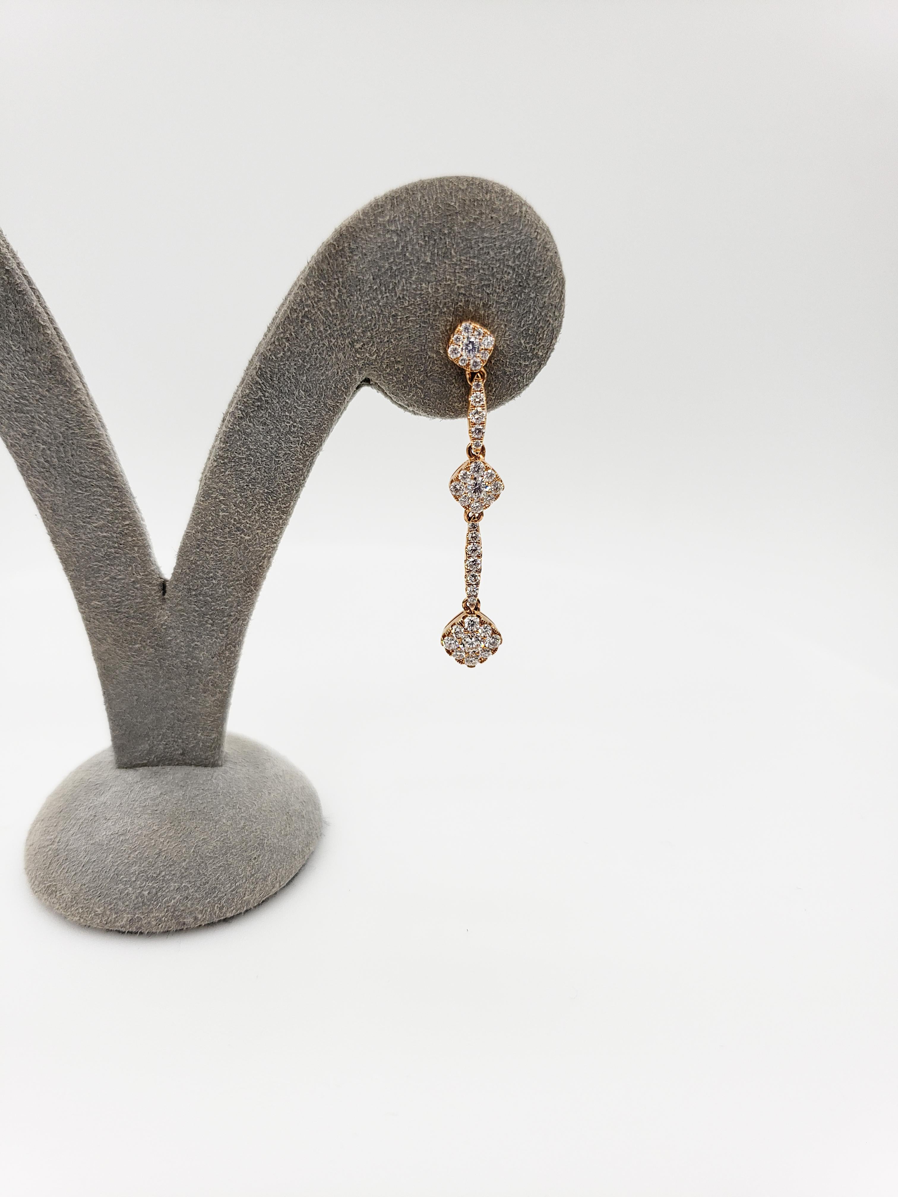 A gorgeous minimalist line drop earrings features three clusters of round diamonds, separated by a line of melee round diamonds, Diamond weigh 1.03 carats total. Made in 18K Rose Gold. 

Style available in different price ranges. Prices are based on