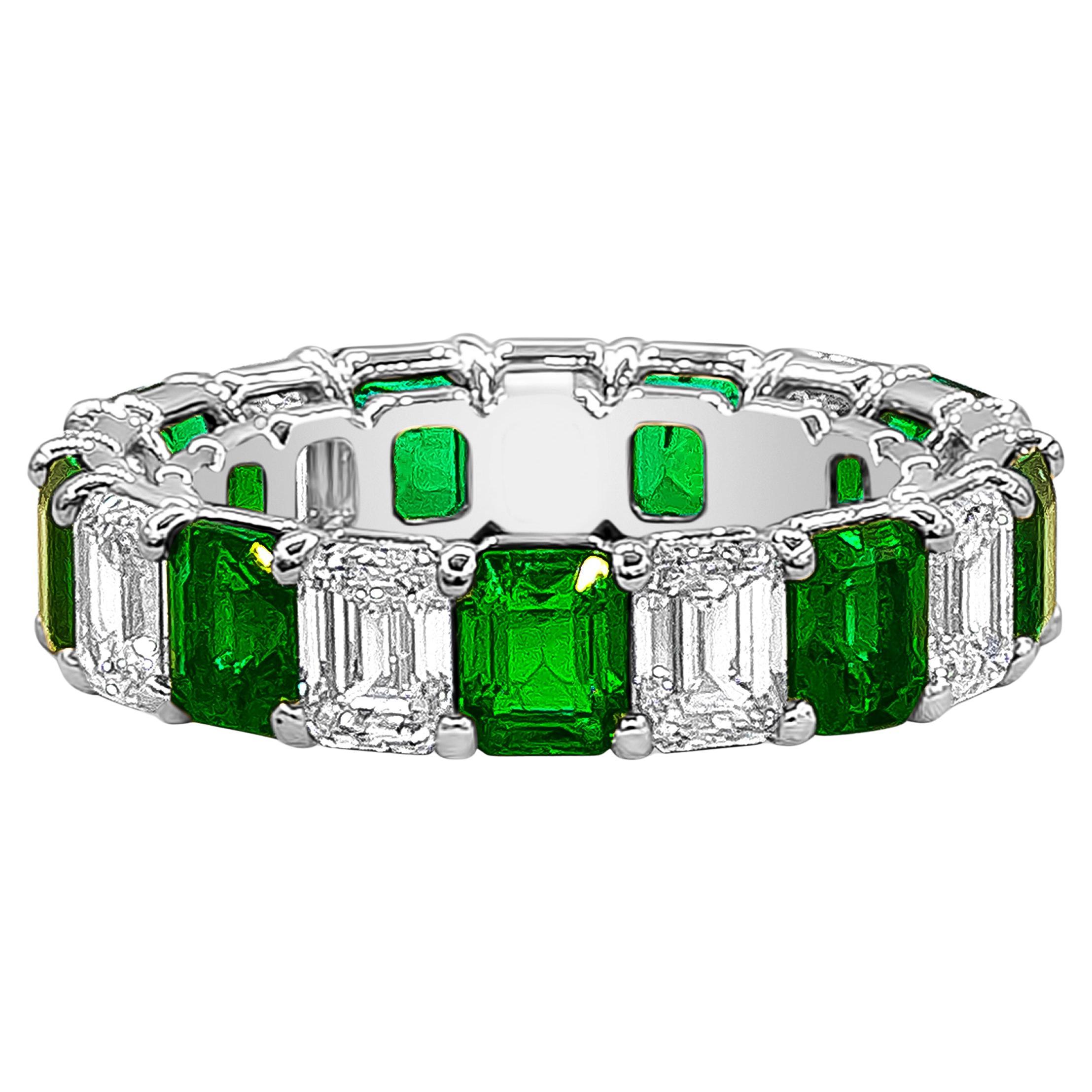 Showcasing an eternity band 4.24 carats total of emerald cut green emeralds. Alternating with 4.21 carats total of emerald cut diamonds, H color and VS in clarity. Made with an open gallery setting in Platinum. Size 6.5 US, resizable upon request