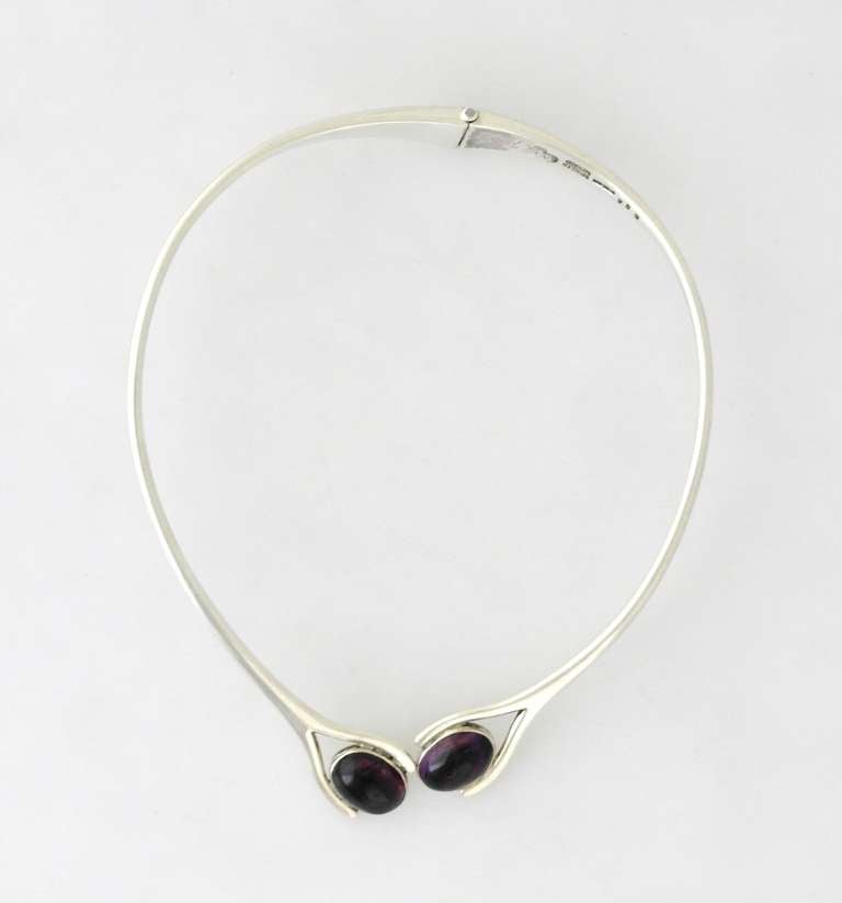 Being offered is a circa 1969 sterling silver necklace by Sigfredo Pineda of Taxco, Mexico. Modernist design with applied amethyst cabochons. Dimensions: inner - 15 3/4