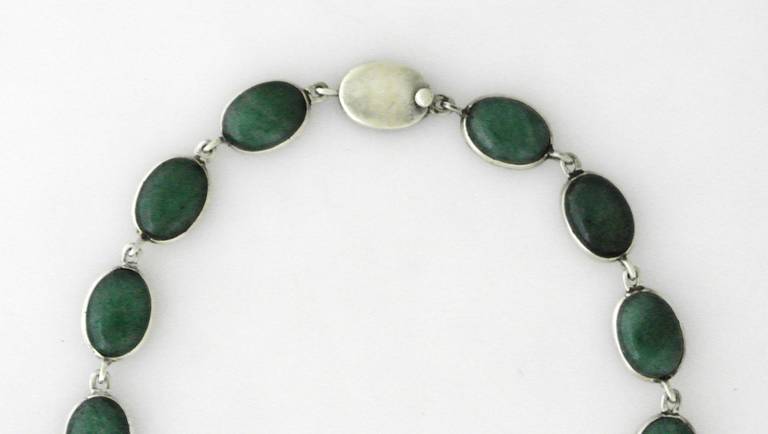 Being offered is a .970 silver necklace by Antonio Pineda of Taxco, Mexico,  with cabachon set oval jadeite links, secured by box clasp.  Dimensions of necklace 16 1/2 inches long.  Fully marked.  In excellent condition.

Stanley Szaro Antonio