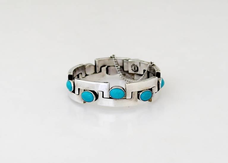 Being offered is a circa 1950 Taxco Turquoise and Sterling Silver Bracelet beaturing links and cabachon set turquoise stones.  Length 6 3/4 inches.  Marked.  In excellent condition.  Craftsmanship is as fine as by Pineda atelier.

In the mountain