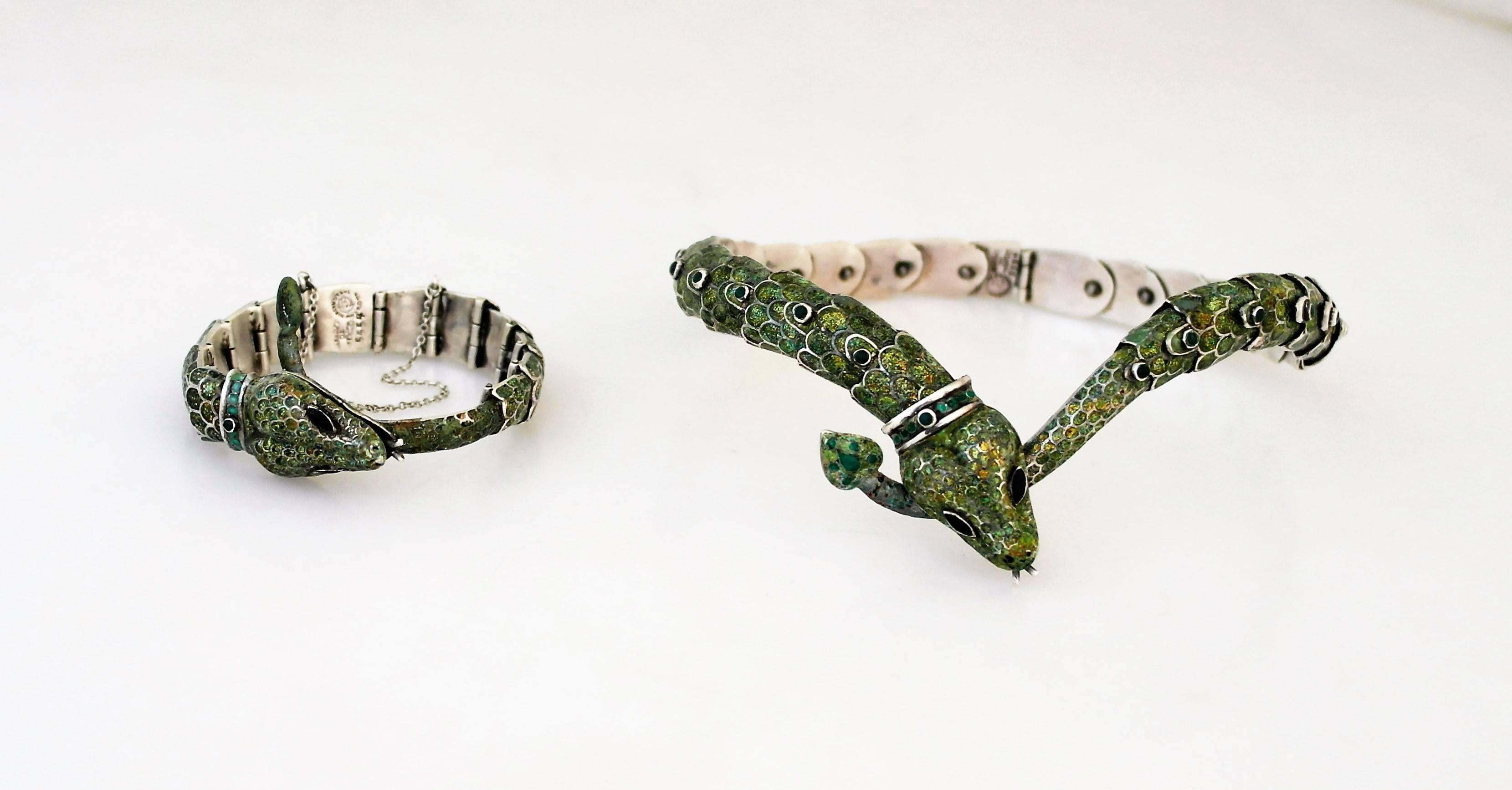Being offered is a sterling silver jewelry suite by Margot Van Voorhies Carr of Taxco, Mexico. Comprising a necklace & bracelet in her snake motif, articulated in a spectrum of iridescent colors. Dimensions: Necklace - 14 1/2