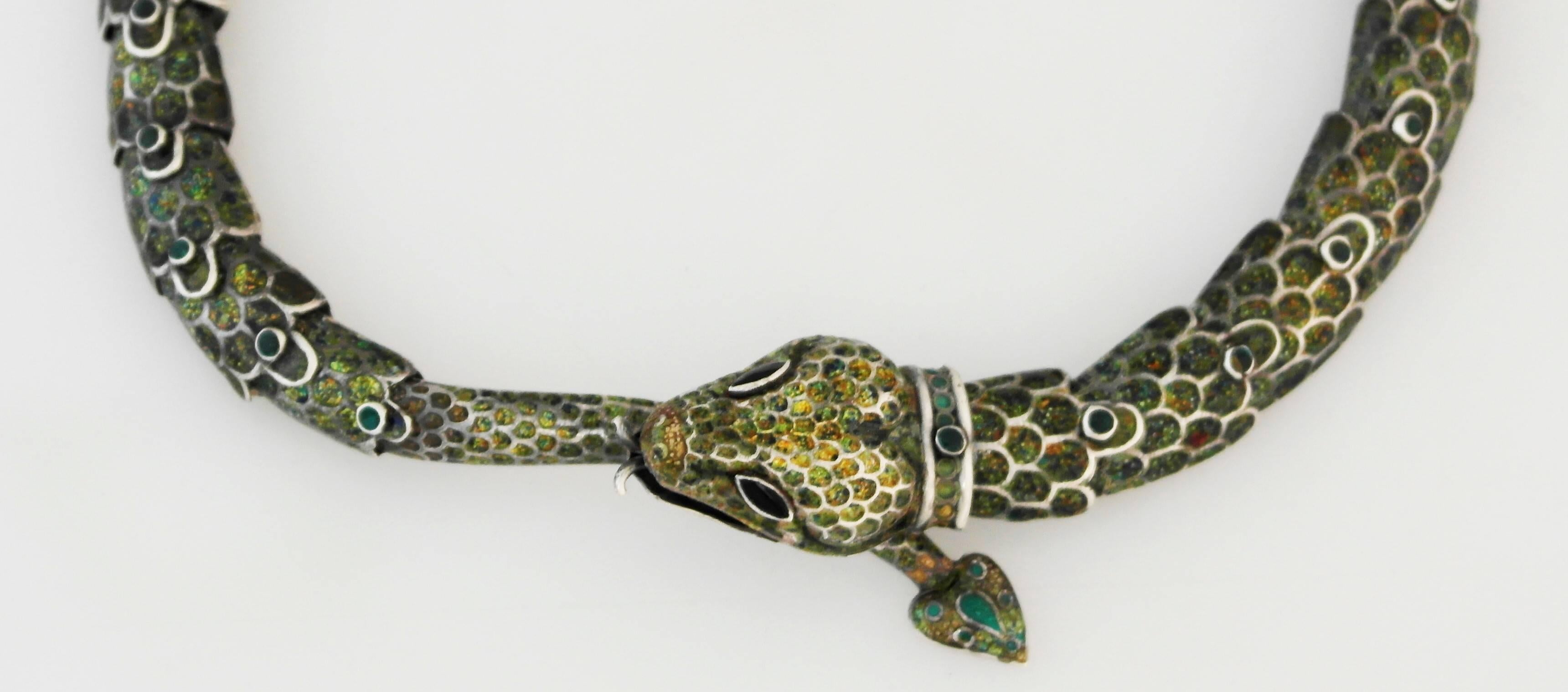 Being offered is a sterling silver necklace by Margot Van Voorhies Carr of Taxco, Mexico. Comprising a necklace in her snake motif, articulated in a spectrum of iridescent colors. Dimensions: Necklace - 14 1/2
