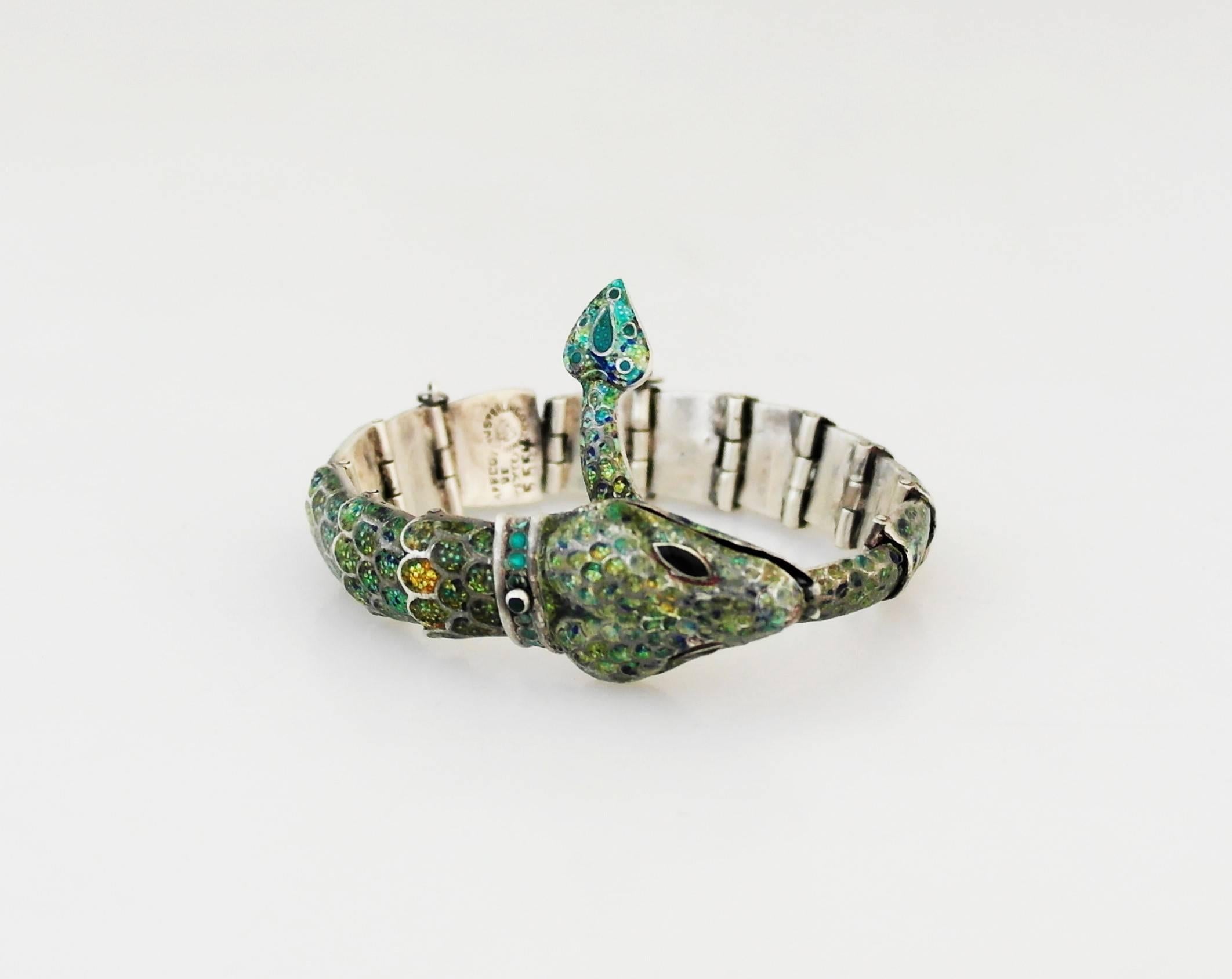 Being offered is a sterling silver bracelet by Margot Van Voorhies Carr of Taxco, Mexico. Comprising a bracelet in her snake motif, articulated in a spectrum of iridescent colors. Dimensions: Necklace - 9 1/2