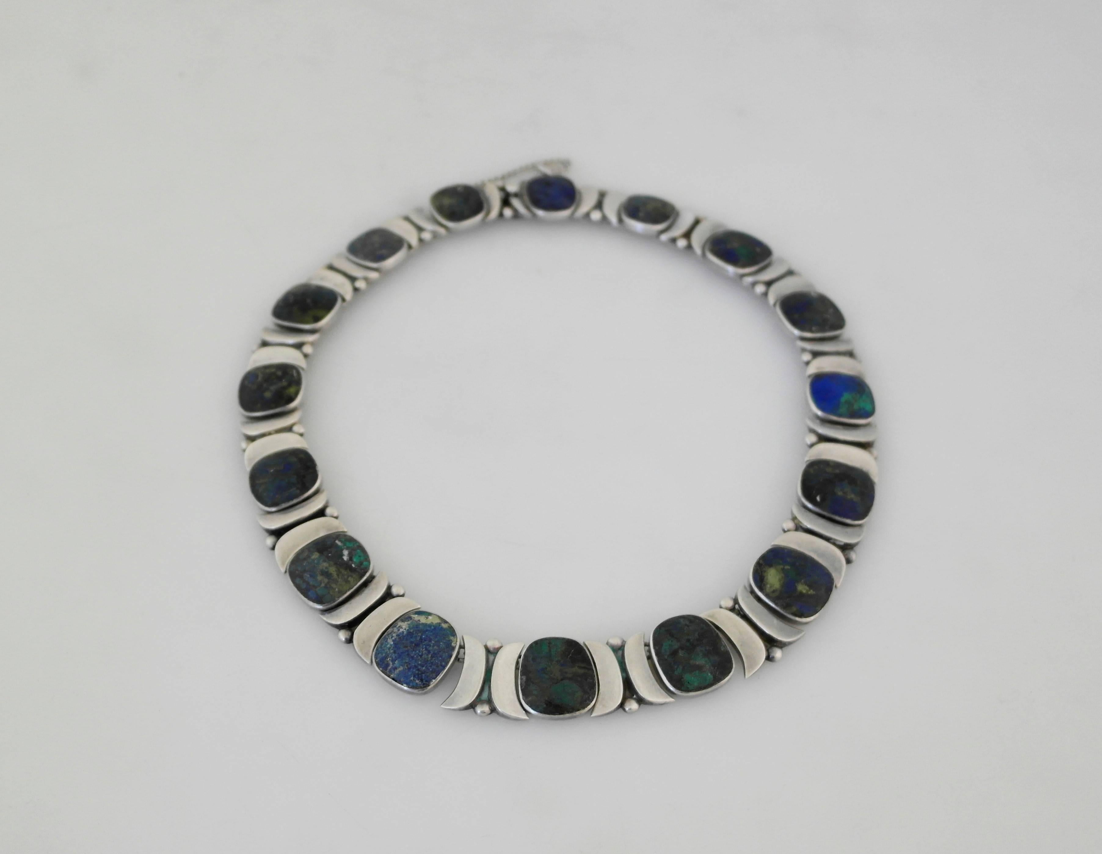 Being offered is a circa 1950 sterling silver and azurite necklace by Felipe Martinez of Taxco, Mexico. Rare necklace manufactured at Felipe's Piedra Y Plata workshop, each link with bezel set native malachite stones; tongue & box closure with