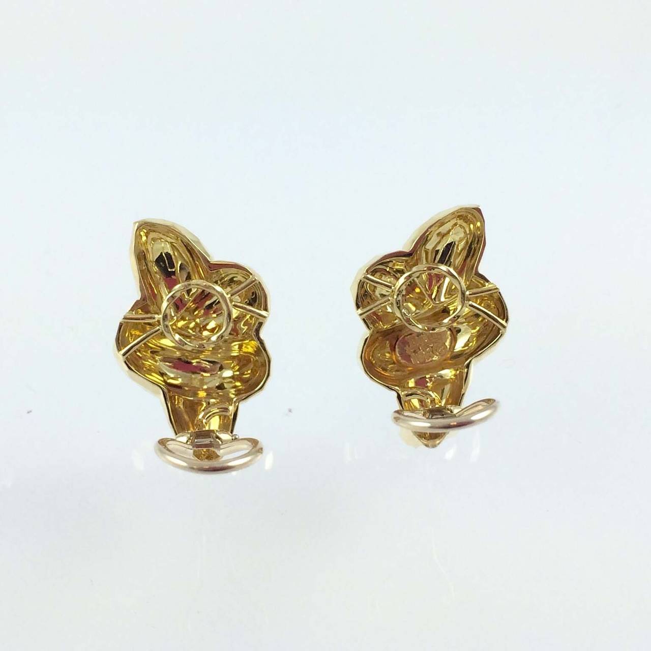 Henry Dunay 18K yellow gold faceted ear clips with omega backs.