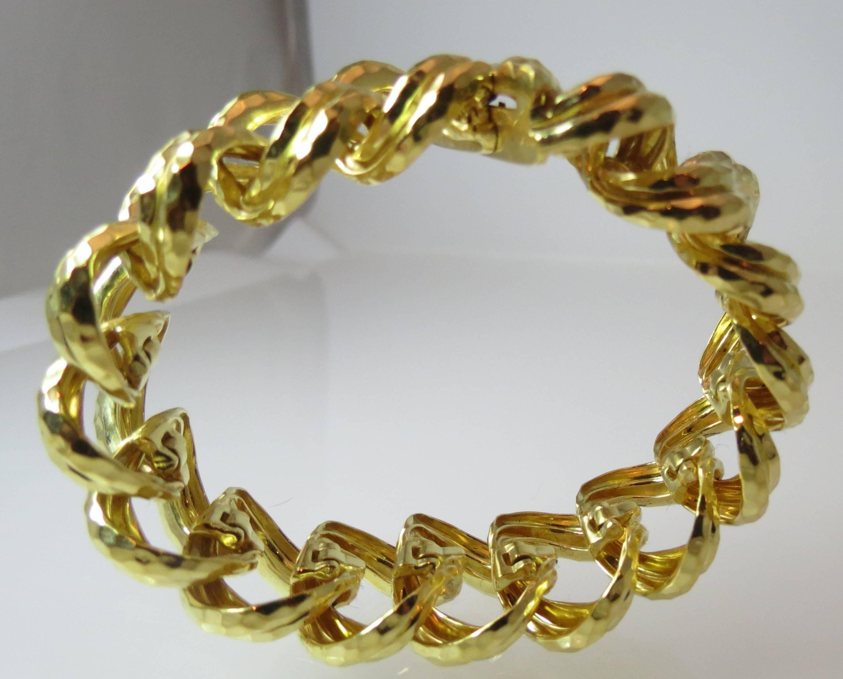 18K yellow gold wide faceted link bracelet by Henry Dunay

Length of bracelet 7 inches
Width of bracelet 7/8 of an inch
Weighs 107 grams
