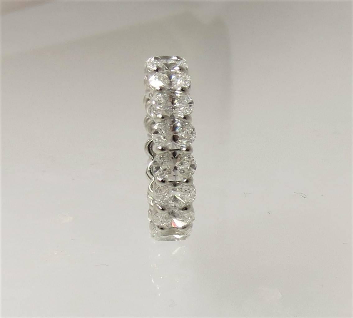 Harry Winston platinum oval diamond eternity band, set with 19 matching oval diamonds weighing 4.57cts total, EF color,  VS clarity, finger size 5.75.

Retails for $32,400