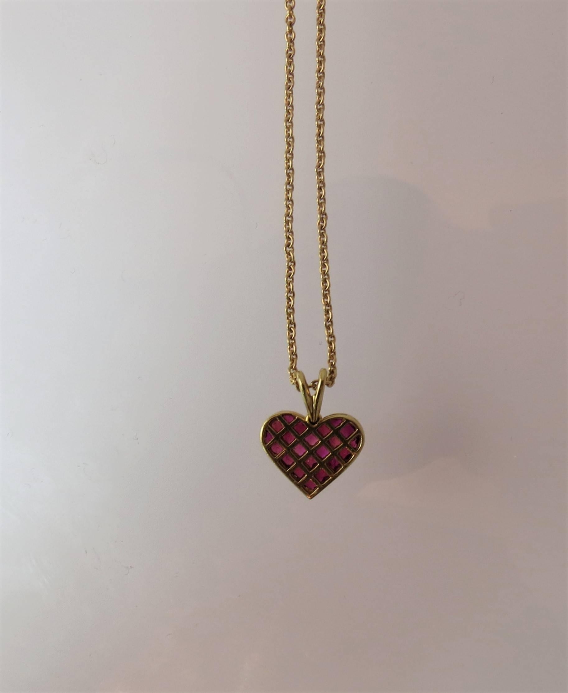 Ambar 18K yellow gold and ruby heart pendant, set with 21 quadrillion rubies, weighing 1.46cts suspended from 18K yellow gold 18.5 inch chain.