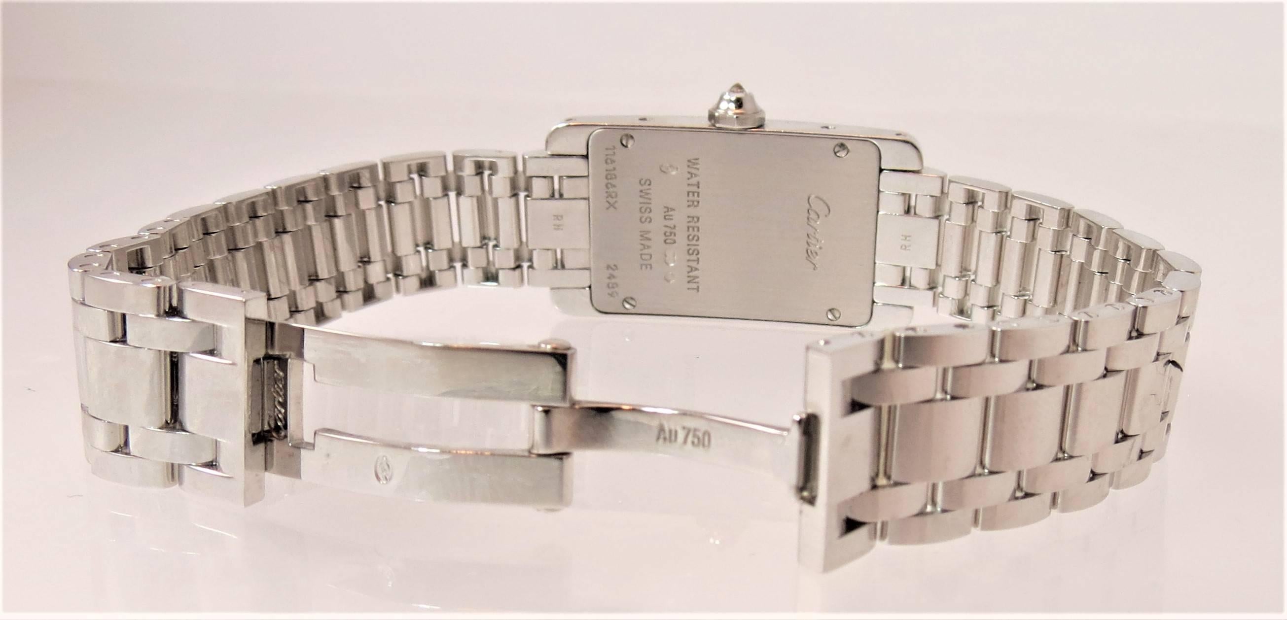 Cartier, brand new, never worn, small size, 18K white gold and diamond Tank Americaine bracelet watch, set on case with 48 full cut round diamonds weighing about 1ct, quartz movement, hidden deployant clasp.
style number WB7073L1

In original