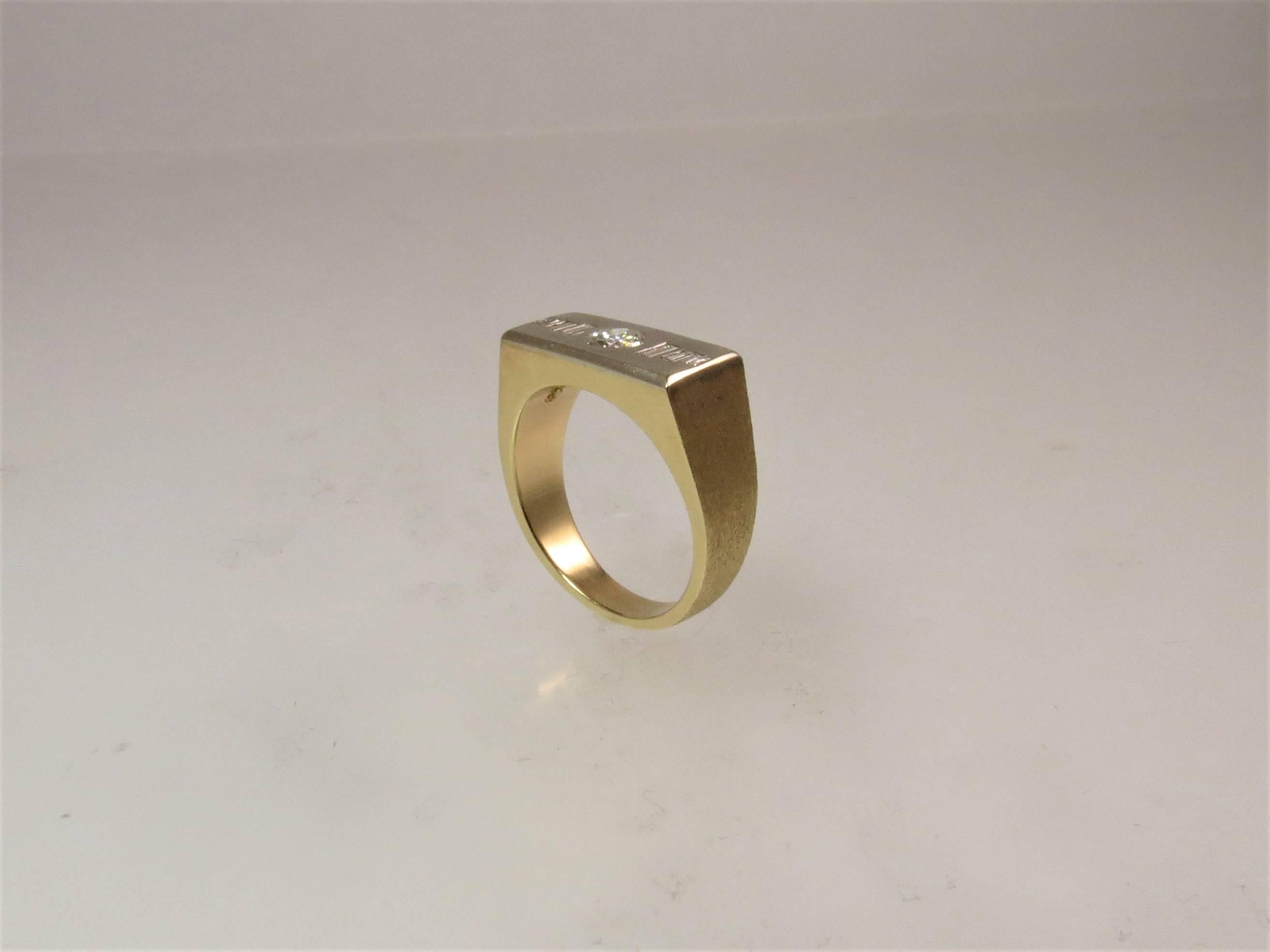 14K yellow gold gents band ring, set with one full cut round diamond weighing .25cts and 6 baguette diamonds weighing .20cts

finger size 8.5, may be sized